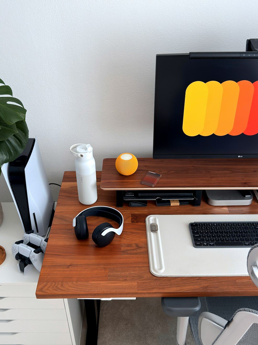 Small editorial team office with magazine layouts pinned to a wall